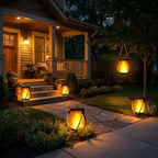 Several flickering flame garden lamps lighting a porch, path, and tree across a cozy yard at dusk